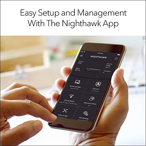 Hands holding a phone with the router management app open