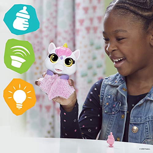 Girl smiling at the Airina unicorn perched on her hand