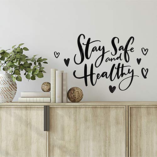 Stay Safe and Healthy script decal with hearts above a wooden sideboard