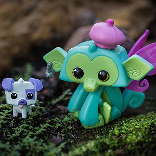 Lucky Monkey and pet puppy figures posed on moss outdoors