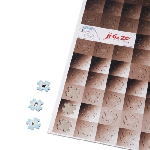 Close-up of shaded sepia Ji Ga Zo puzzle piece sheets with icon-marked pieces
