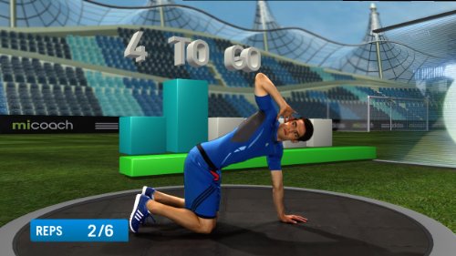Man in blue doing a kneeling rotation stretch in a stadium