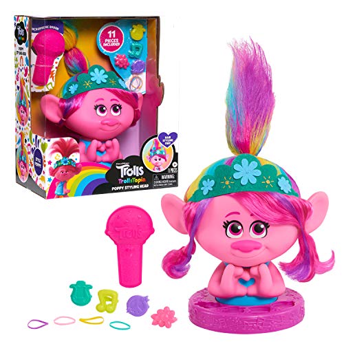 Pink troll styling head with rainbow hair, its box, a microphone brush and clips