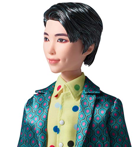 Close-up of the BTS RM doll face and teal jacket, turned to the left