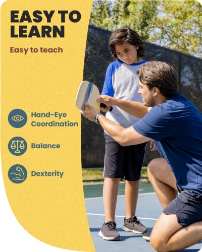Man showing a boy how to hold a paddle on a court: easy to learn