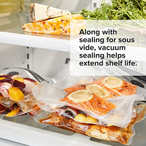 Vacuum sealed salmon, vegetables and cheese stored on fridge shelves