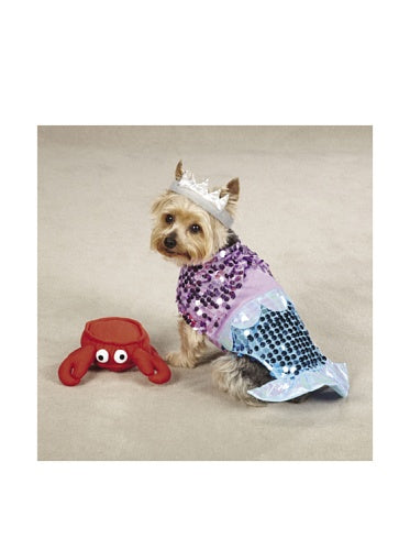 Yorkie in a purple and blue sequin mermaid costume and silver crown beside a crab toy