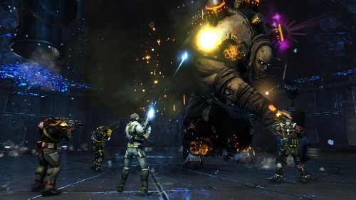 Defiance gameplay: a squad firing at a huge armored boss in a dark arena