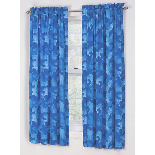 Two blue curtain panels printed with light blue superhero silhouettes