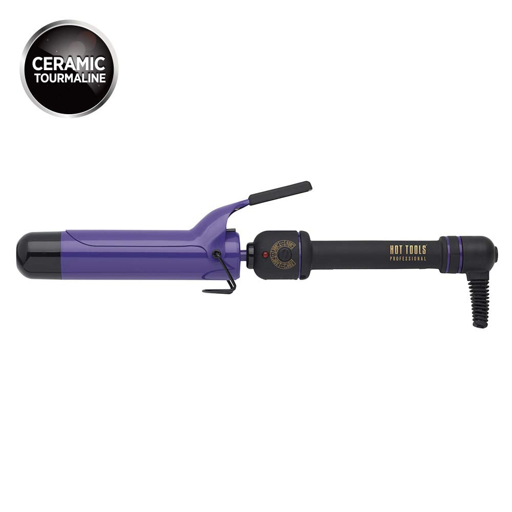 Purple and black curling iron laid flat with a ceramic tourmaline badge