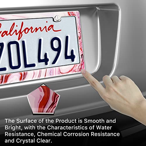 Finger touching the glossy pink marble frame around a California plate