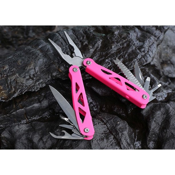 Pink Ozark Trail multi-tool opened with blades out on dark rock