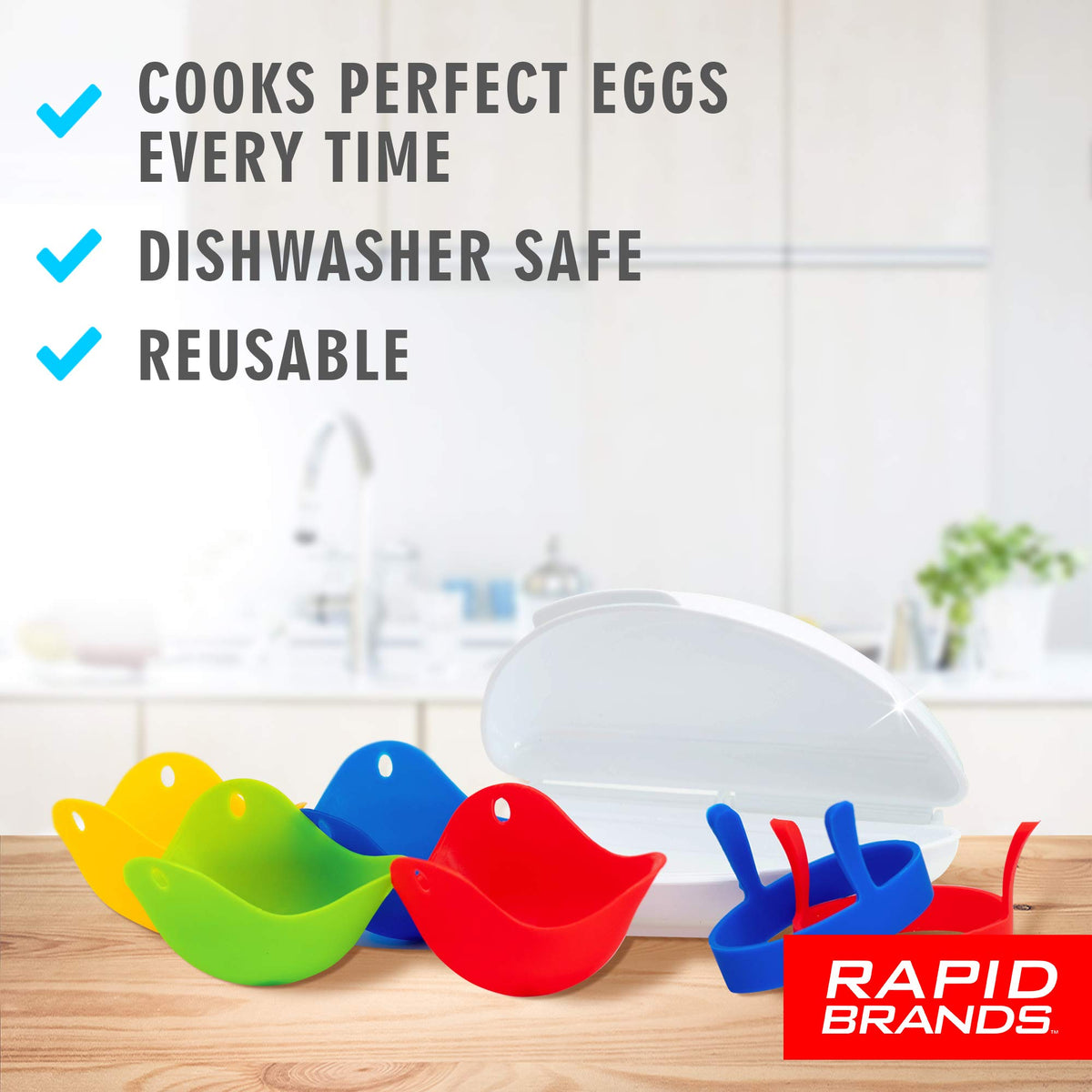 Colourful silicone egg poachers, egg rings and omelette maker on a kitchen counter