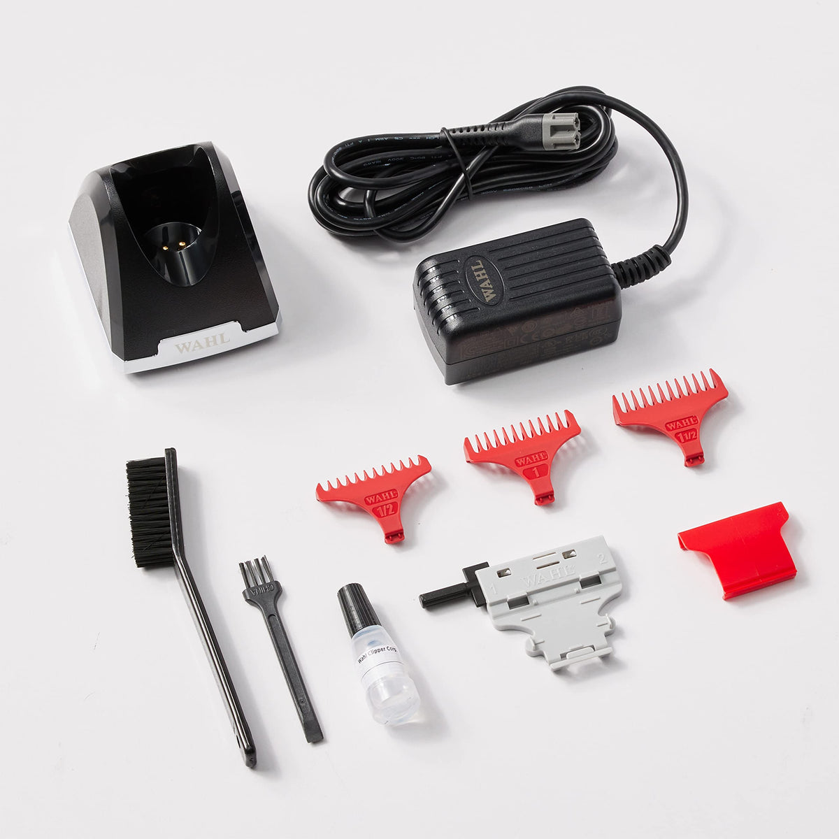 Trimmer accessories: charging stand, power cord, four red guides, oil, brushes and blade tool