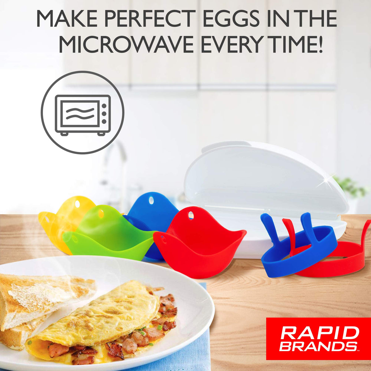 Egg poachers, egg rings and white omelette maker beside a plate of bacon omelette