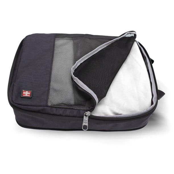 SwissTech packing cube partly unzipped with clothes packed inside